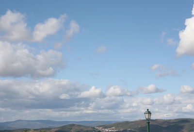 Low angle view of communications tower against sky