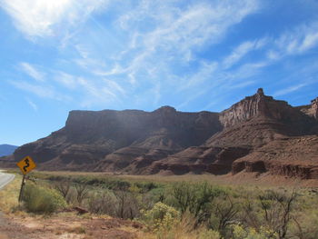 Scenic view of mountains against blue sky