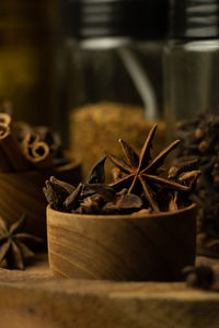 Spices and herbs in dark on selective focus