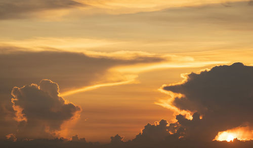 Low angle view of dramatic sky during sunset