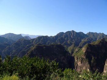 Scenic view of mountains against clear sky