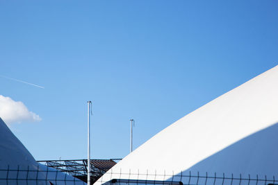 Low angle view of building against clear blue sky