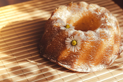 Cupcake decorated chamomile flower in the rustic style. authentic photo. easter concept greeting