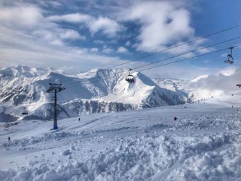 Scenic view of snowcapped mountains against sky