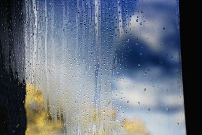 Full frame shot of wet window in rainy season