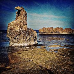 Scenic view of sea against blue sky