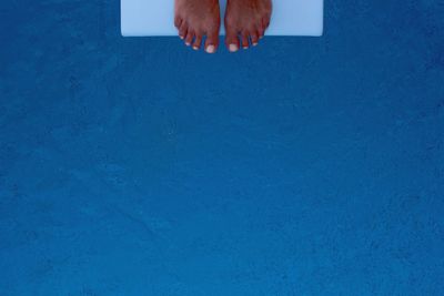 Woman in bikini against blue sky