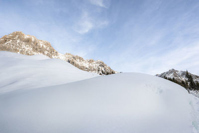 Scenic view of snowcapped mountain against sky