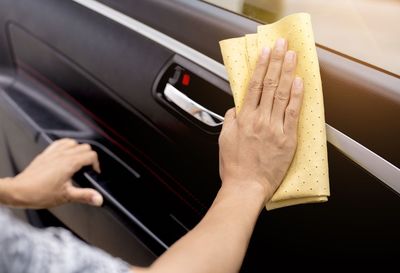 Close-up of woman hand holding car