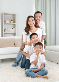 Portrait of happy family at home