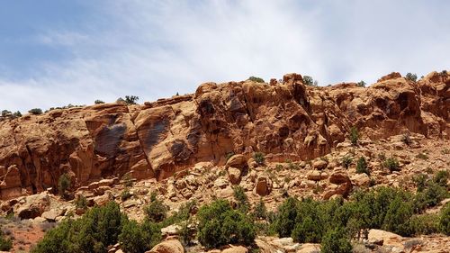 Rock formations on mountain against sky