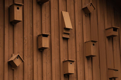 Low angle view of birdhouse on wall