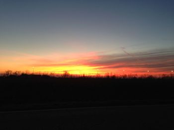 Silhouette landscape against sky during sunset