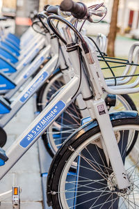 Close-up of bicycle parked in row