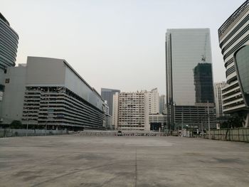 Modern buildings in city against clear sky