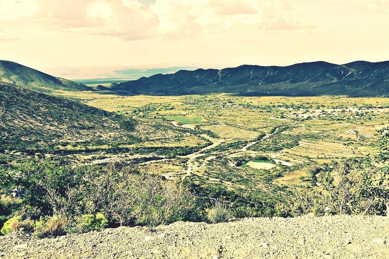 landscape, tranquil scene, tranquility, mountain, scenics, beauty in nature, nature, mountain range, sky, field, rural scene, non-urban scene, high angle view, agriculture, horizon over land, remote, idyllic, growth, outdoors, hill