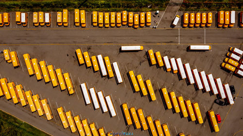 High angle view of yellow flags on road by building