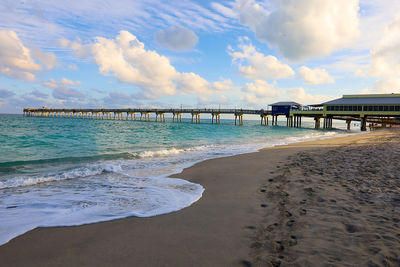 Pier over sea against sky