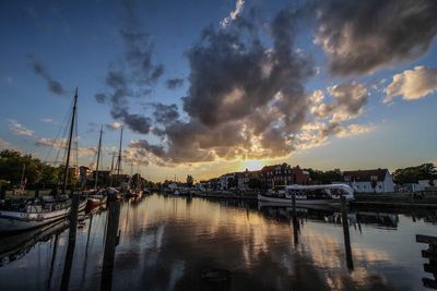 Sailboats in marina at sunset