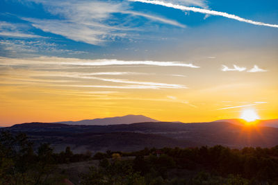 Scenic view of silhouette landscape against sky during sunset