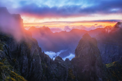 Scenic view of mountains against sky during sunset