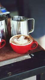 Close-up of coffee cup on table