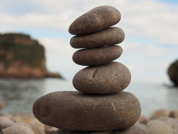 Close-up of stone stack on beach