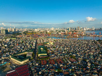 Aerial view of cityscape of makati with sea port, the business center of manila, view from sea. 