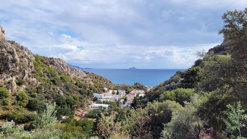 Panoramic shot of townscape by sea against sky