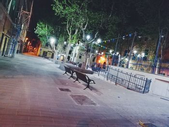 Cars on road in city at night