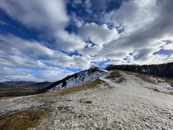 Scenic view of snow covered mountain against sky