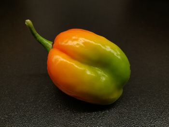 Close-up of bell peppers against black background