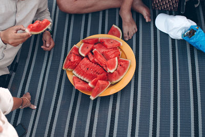 People eating watermelon