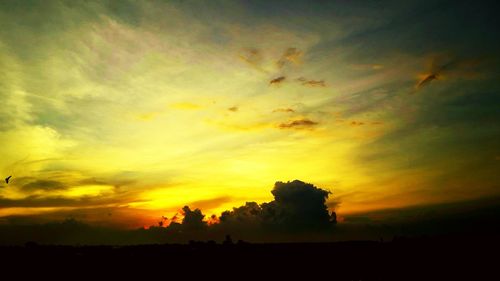 Silhouette of trees against sky during sunset