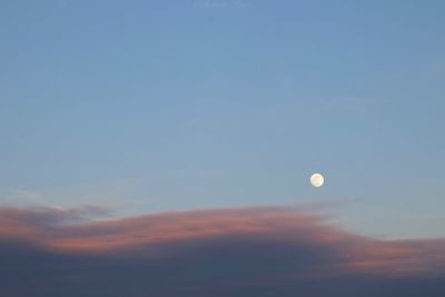 Low angle view of moon against sky at sunset