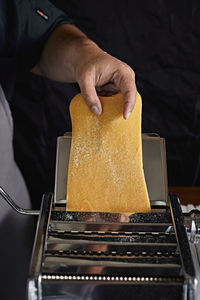 Midsection of man preparing food