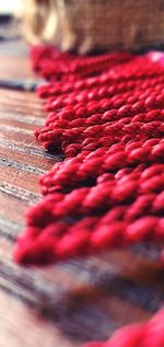 Close-up of red ropes on table