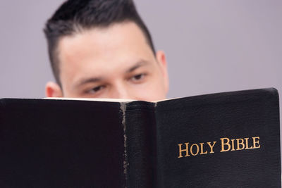 Man reading bible at home