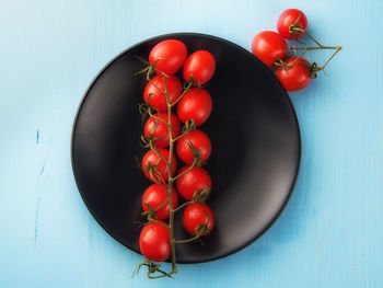 High angle view of tomatoes in container on table