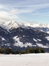 Scenic view of snowcapped mountains against sky