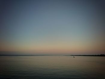 Scenic view of sea against clear sky during sunset