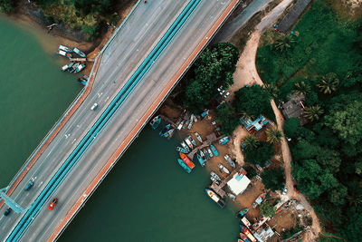 High angle view of river amidst trees in city