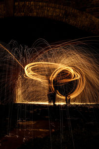 Light trails on fire at night