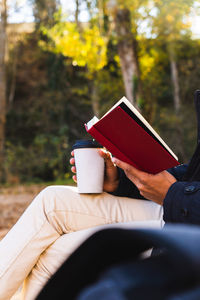 Woman holding coffee cup