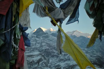 Player flags against himalayas during sunrise