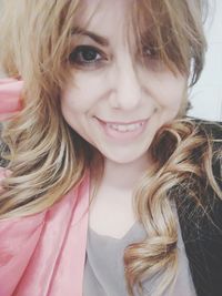 Close-up portrait of a smiling young woman