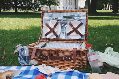 View of picnic basket on field