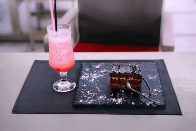Close-up of drink and dessert on table