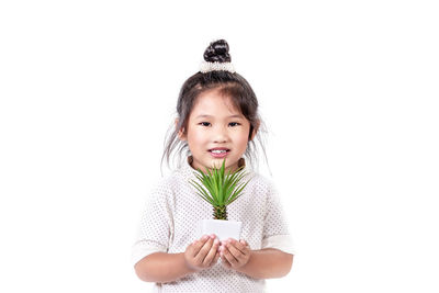 Portrait of a smiling girl over white background