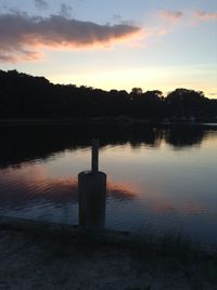 Scenic view of lake at sunset